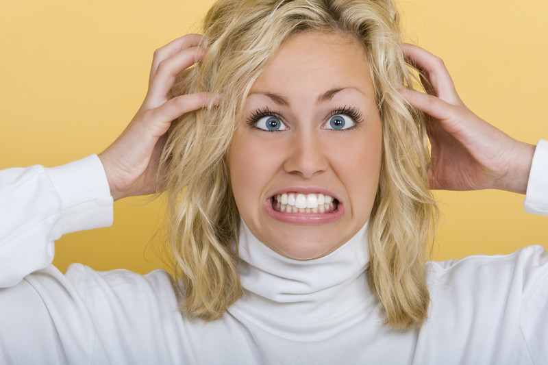 divorcing a narcissist is a nightmare: frustrated blonde woman on yellow background