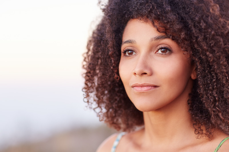 shifted my vision: beautiful african american woman looking into the distance