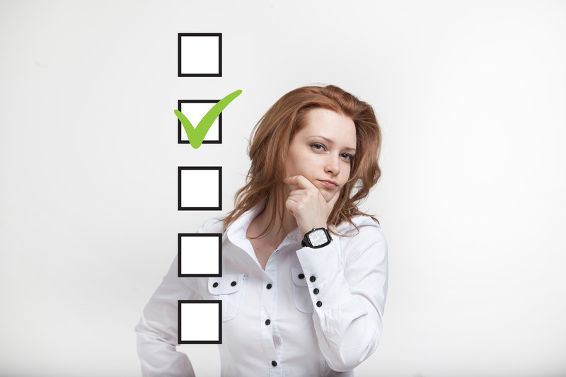 post-divorce checklist: woman looking at a list of things to do