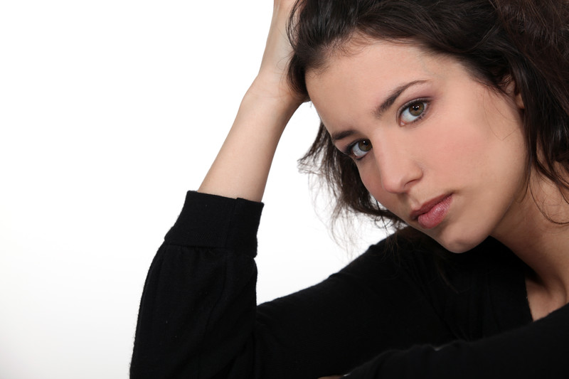 mistakes of stepmothers: concerned woman on white background