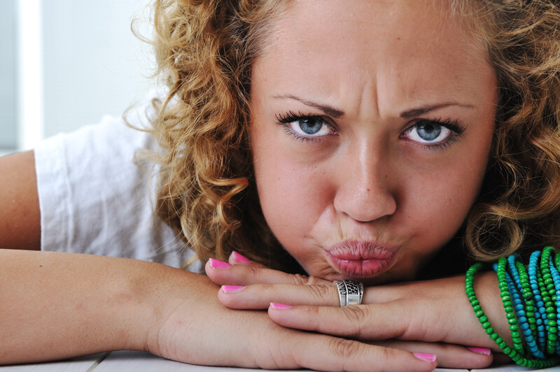 angry teen girl with pursed lips