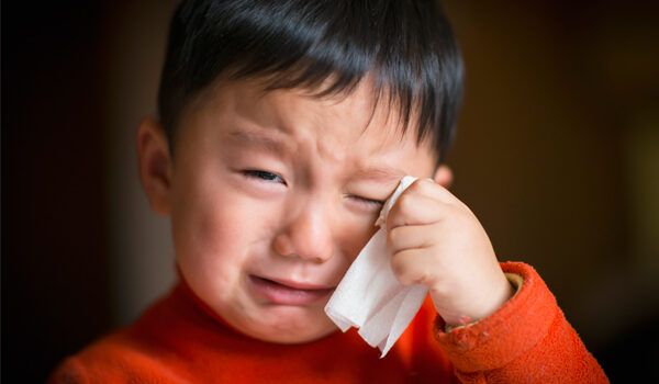 Physical & Emotional Effects of Divorce on Children: Small Asian boy crying