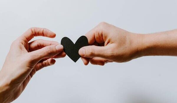 Loved Ones After Divorce: two hands hold a paper heart