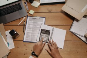 divorced parents determining college costs on a calculator