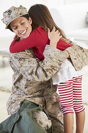 Uniform Deployed Parent Custody and Visitation Act: military mother hugging young daughter