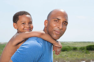 Black Dad Matter: Black dad gives his son a piggyback ride