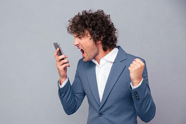 Dealing with Difficult Clients: angry male client yelling at smartphone